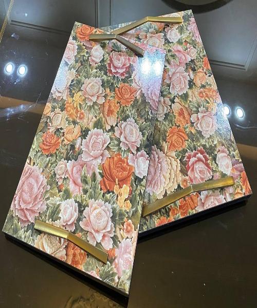 A set of serving trays consisting of two pieces in the shape of roses with a very wonderful shiny texture - an elegant, high-quality masterpiece.