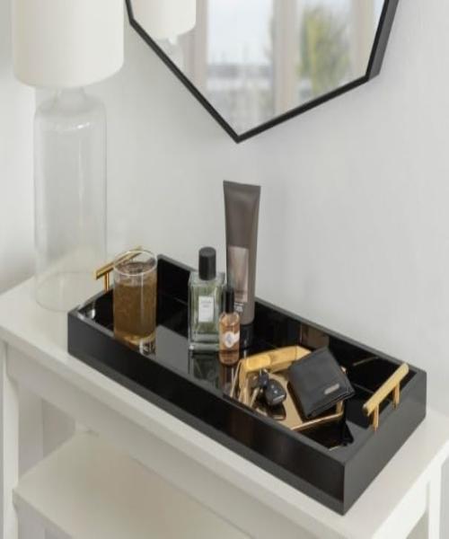Wooden serving tray The new rectangular tray is as eye-catching as it is useful, made of wood with a high-gloss finish and polished metal handles, and is sturdy enough for serving