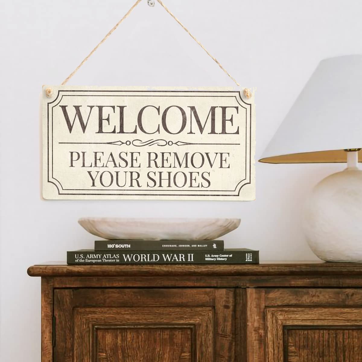 Wooden welcome sign hanging at home entrance