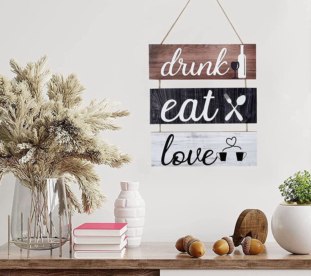 An encouraging and cheerful hanging wooden sign consisting of 3 pieces (Drink + Eat + Love)